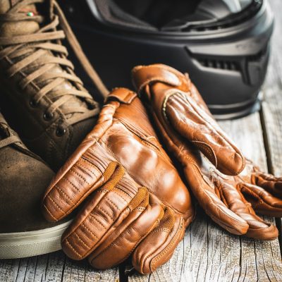 Safety motorcycle accessories. Leather gloves, helmet and shoes